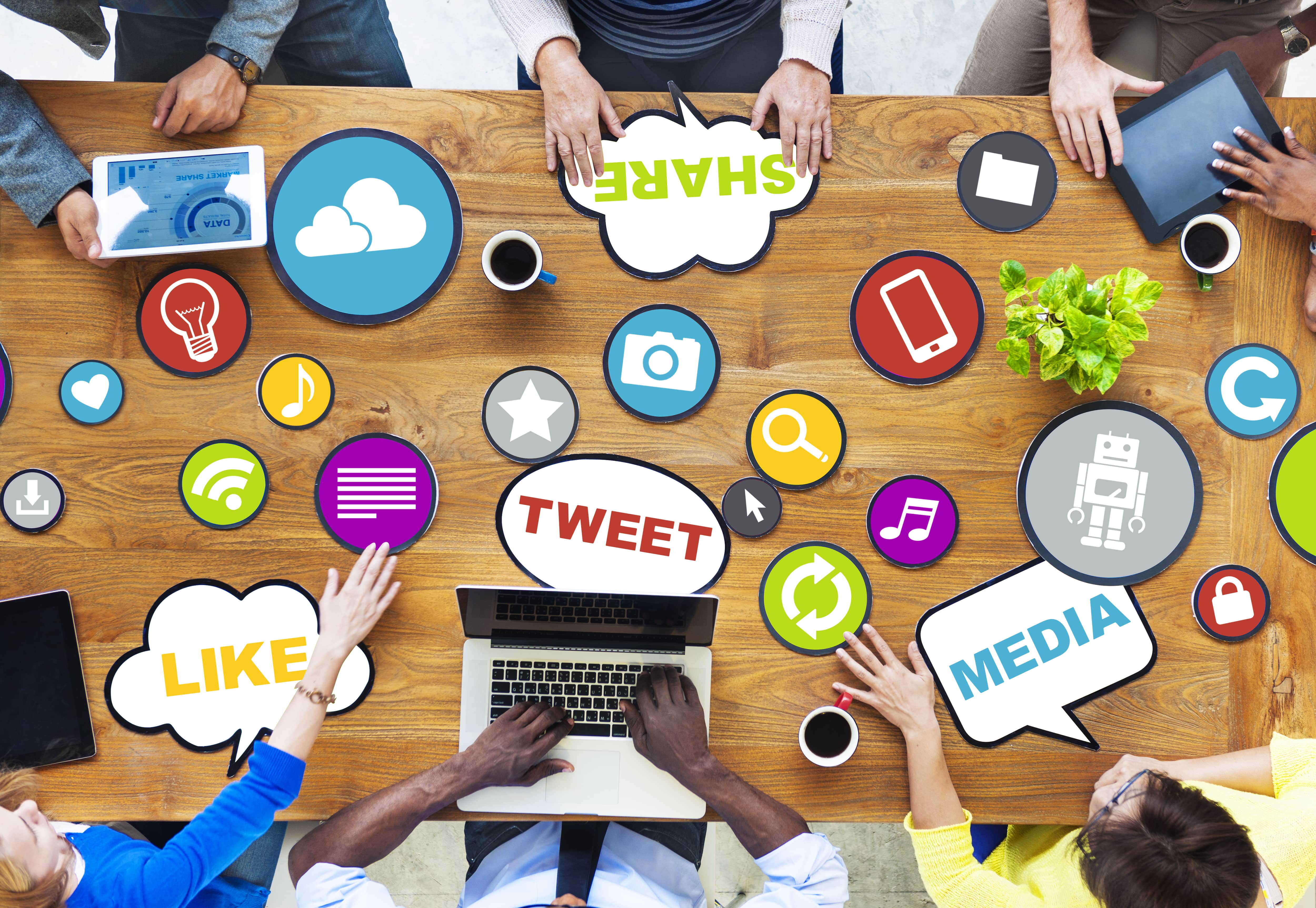 Conference table top with an array of social media branded stickers.