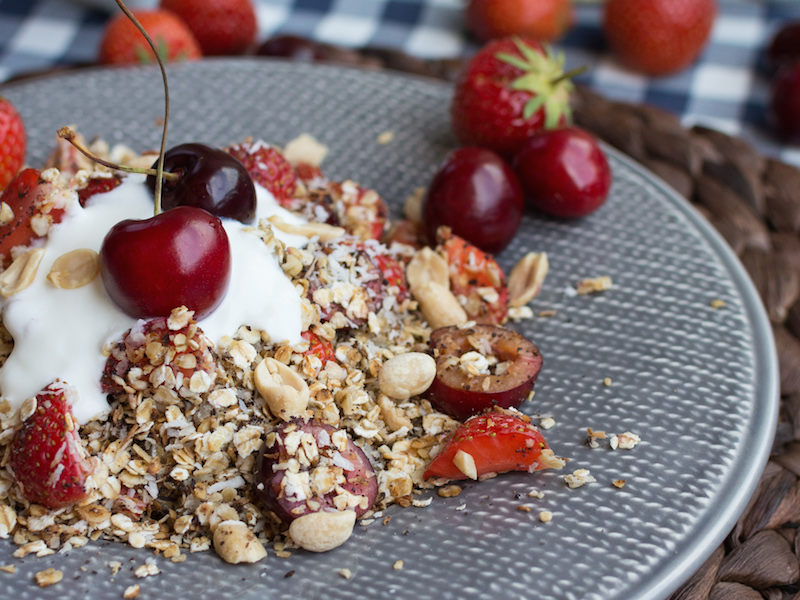 Homestyle granola salad made with berries, cherries, granola and yogurt.